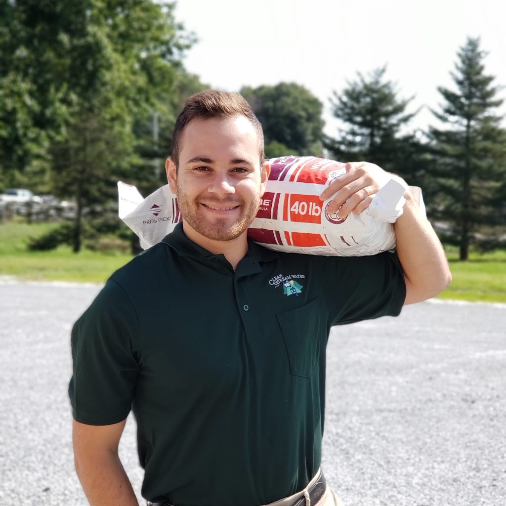 Man carrying a bag of softener salt