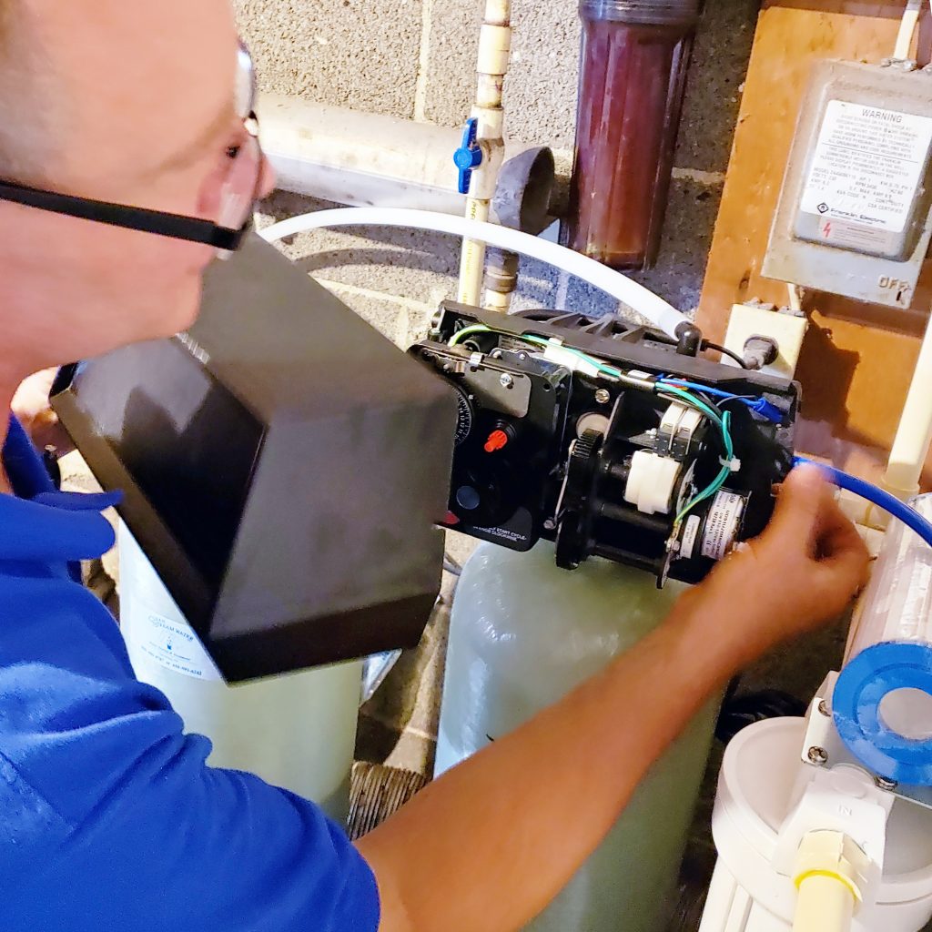 Technician working on water softener