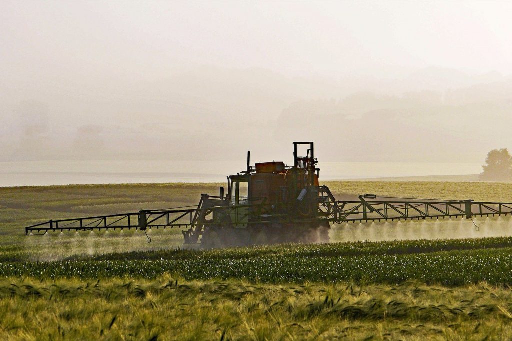 Tractor fertilizing field