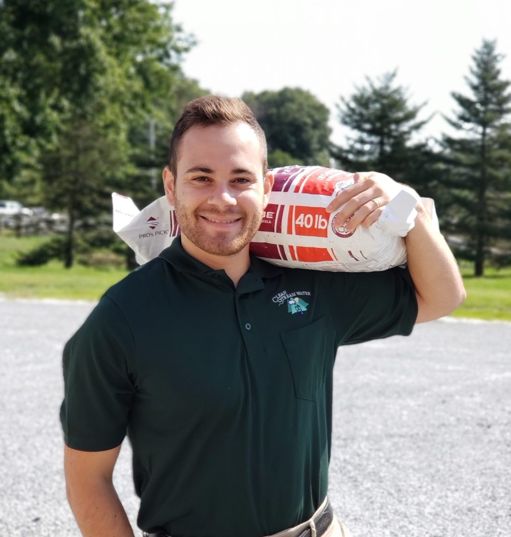 Man carrying a bag of softener salt